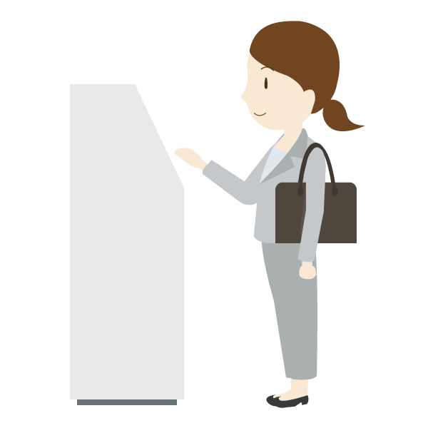 受付システムを操作する女性会社員