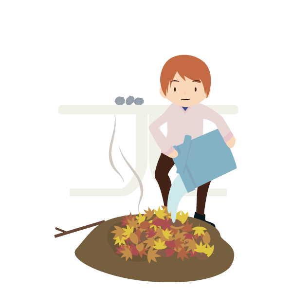 焼き芋をした後の火をバケツの水で消す男性