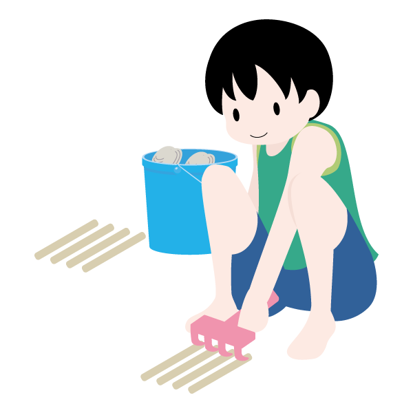 潮干狩りをしている少年