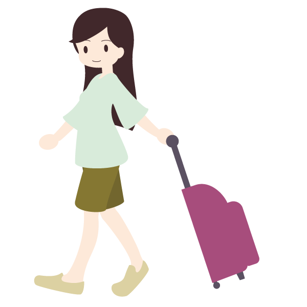 スーツケースを引いて歩く女性