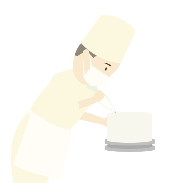 ケーキのデコレーションをするパティシエ