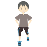 アキレス腱を伸ばす少年