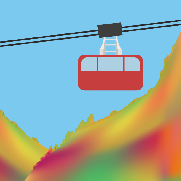 紅葉した山間を移動するロープウェイ