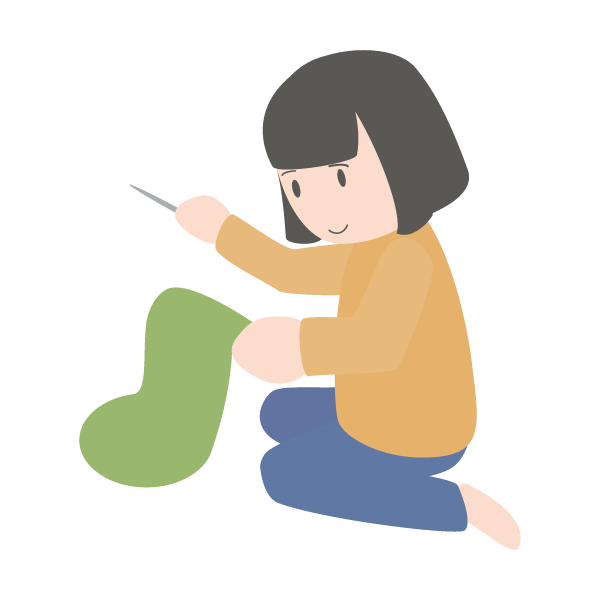 プレゼントを入れる靴下を縫う母親