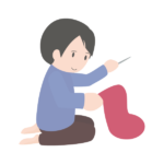 プレゼントを入れる靴下を縫う父親
