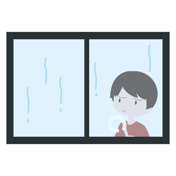 雨が止むのを待っている男の子